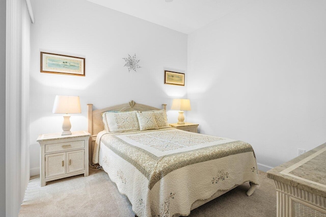 bedroom featuring light colored carpet