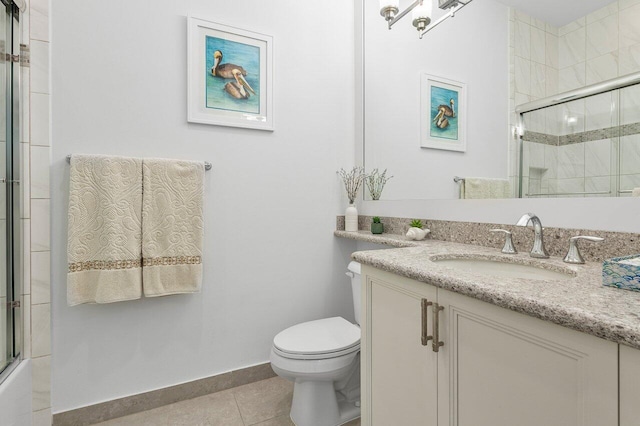 full bathroom featuring tile patterned floors, vanity, toilet, and enclosed tub / shower combo