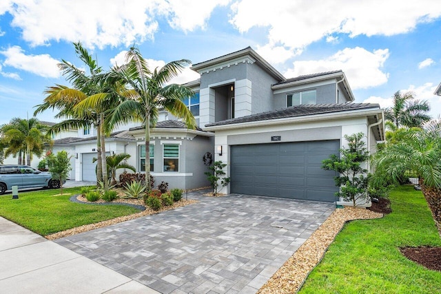 view of front facade with a garage and a front yard