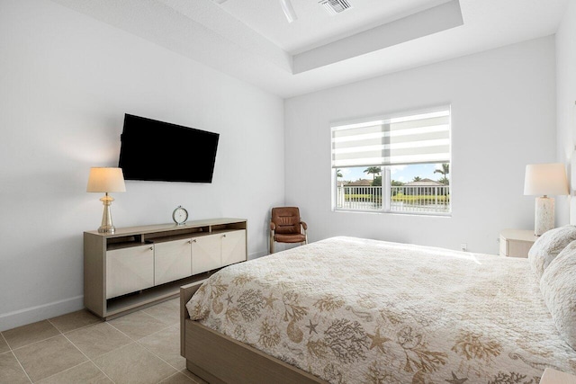 bedroom featuring a raised ceiling