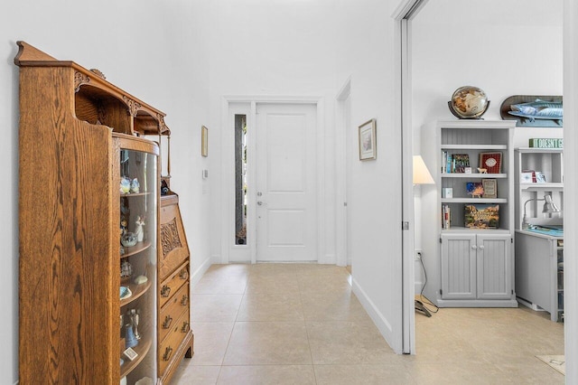 foyer entrance featuring light tile patterned flooring