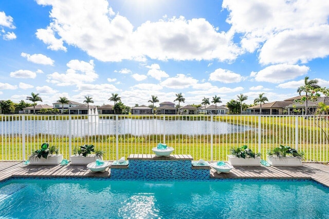 view of pool featuring a water view