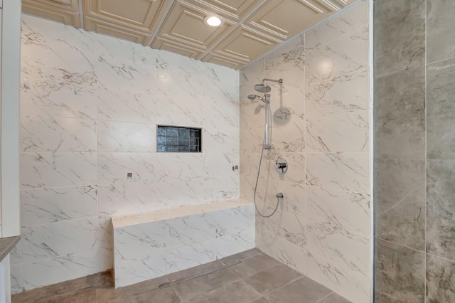 bathroom featuring a tile shower