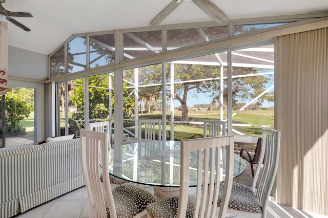 sunroom with ceiling fan and lofted ceiling