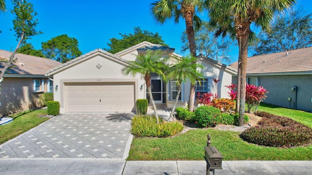 single story home with a garage