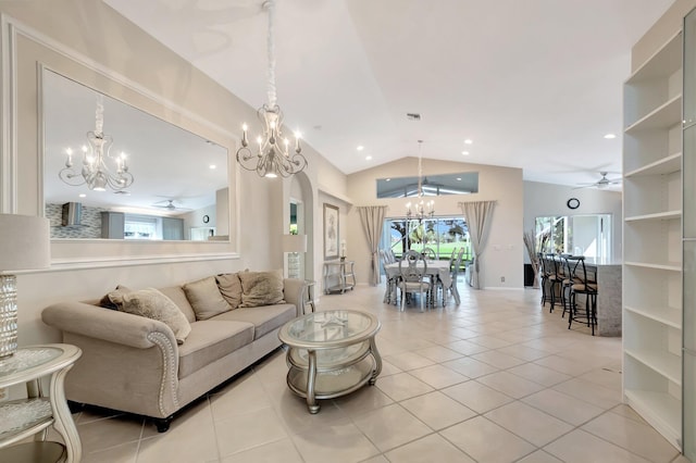 tiled living room featuring ceiling fan and vaulted ceiling