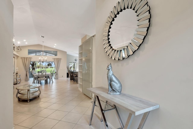 6761 Sun River Rd, Boynton Beach, FL 33437 - corridor with a chandelier, lofted ceiling, and light tile patterned floors