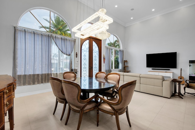 dining room featuring crown molding and an inviting chandelier