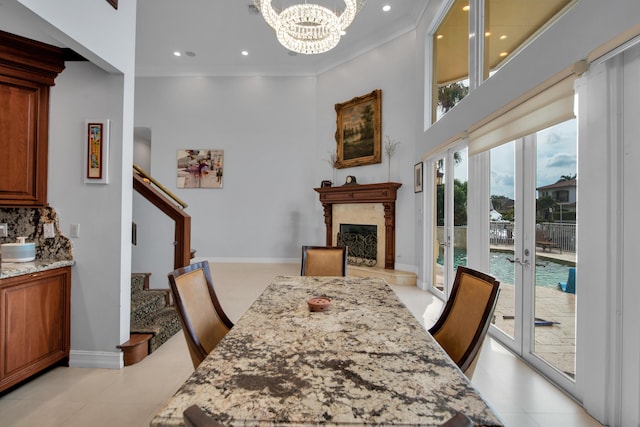 dining space featuring a chandelier and ornamental molding