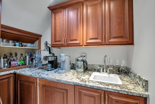 bar with light stone counters and sink