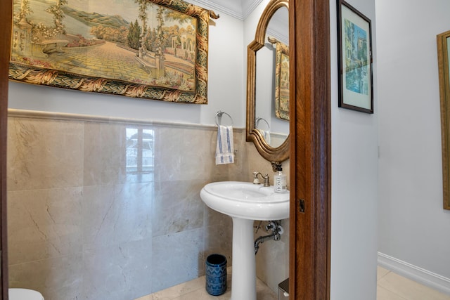 bathroom featuring crown molding, tile patterned flooring, and tile walls