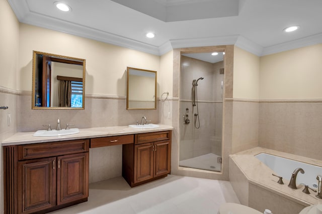 bathroom featuring vanity, tile walls, and ornamental molding