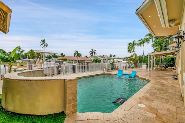 view of swimming pool with a patio