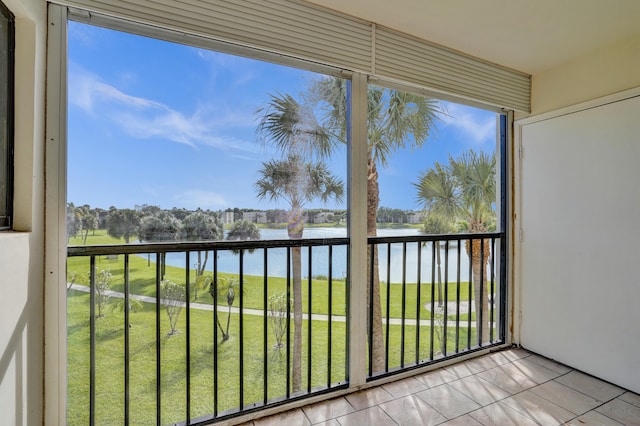 balcony featuring a water view