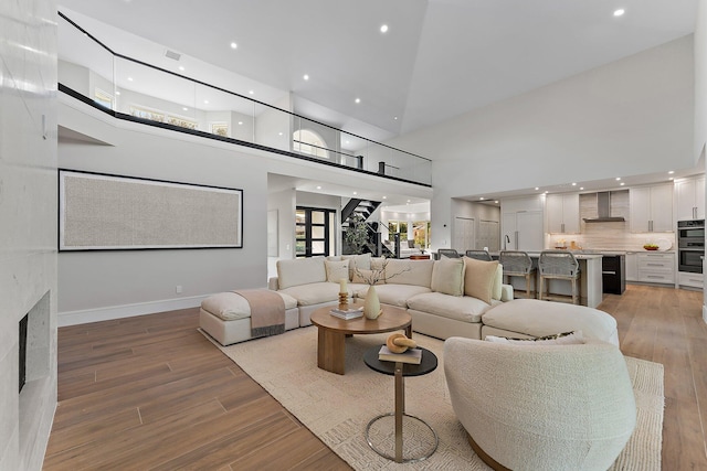 living room featuring a towering ceiling