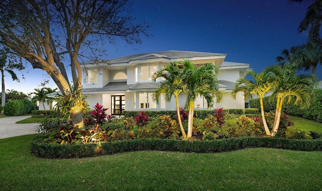 view of front of home with a front lawn