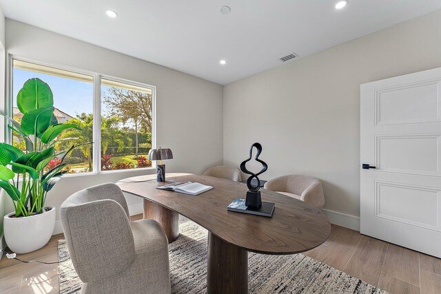 office with light hardwood / wood-style floors