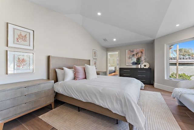 bedroom with vaulted ceiling and dark wood-type flooring