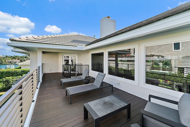 wooden deck with a water view