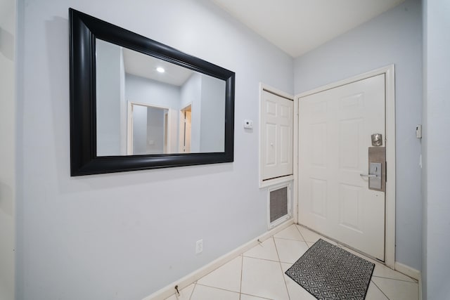 entrance foyer with light tile patterned floors