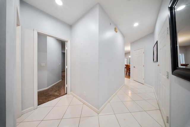 hall with light tile patterned flooring