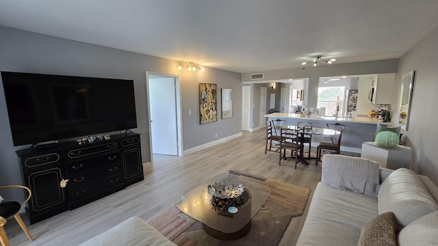 living room with light hardwood / wood-style floors