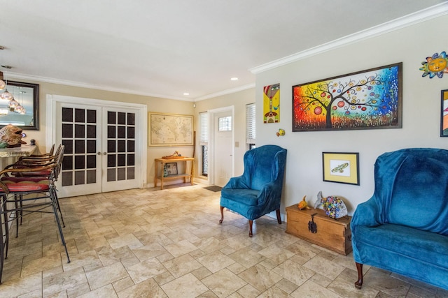 sitting room featuring crown molding and french doors