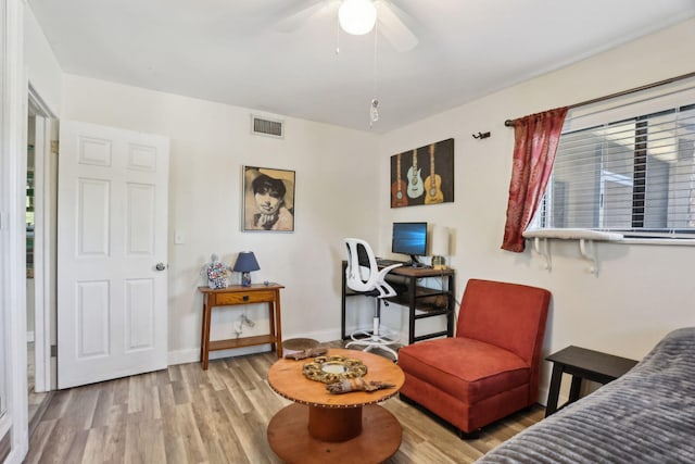 interior space featuring ceiling fan, light hardwood / wood-style flooring, and plenty of natural light