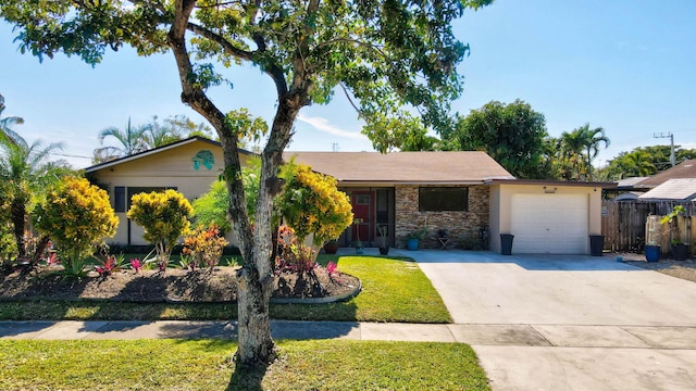 ranch-style home with a garage and a front yard