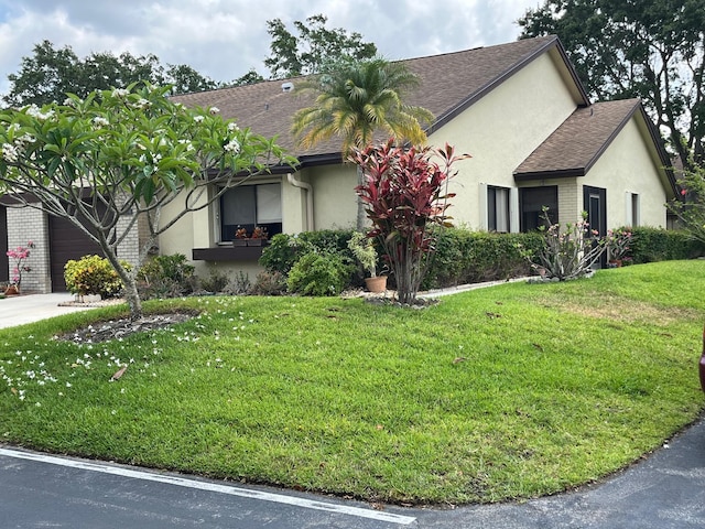 view of front of home with a front lawn