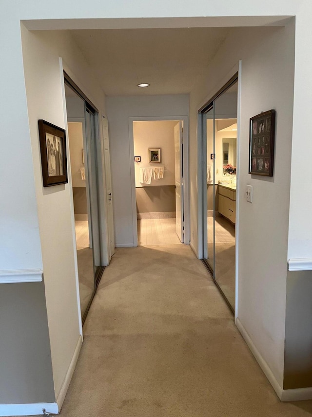 hallway with light carpet