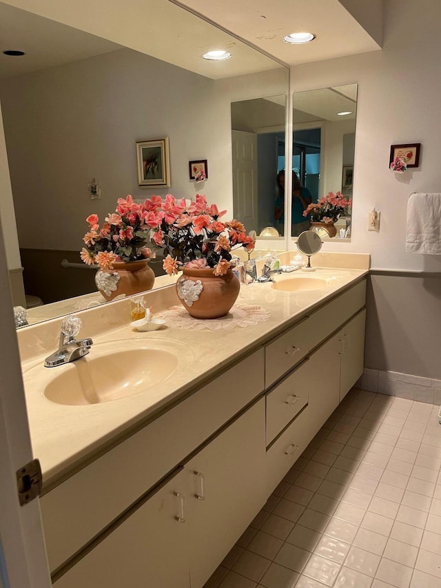 bathroom featuring tile patterned floors and vanity