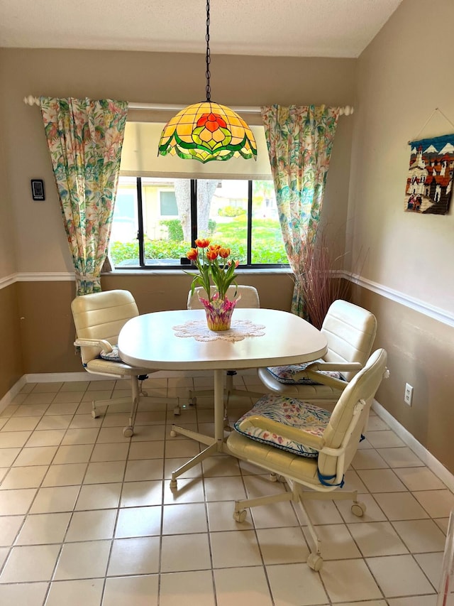 tiled dining space with plenty of natural light