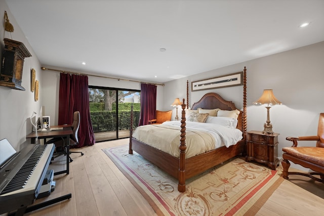 bedroom featuring access to exterior and light wood-type flooring