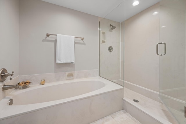 bathroom featuring independent shower and bath and tile patterned floors