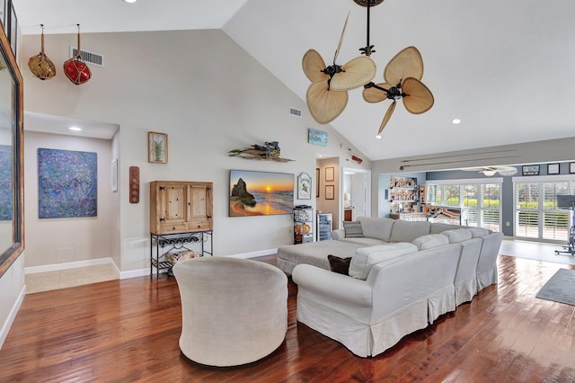 living room with ceiling fan, high vaulted ceiling, and dark hardwood / wood-style floors