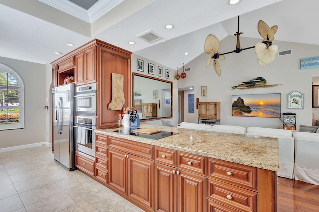 kitchen with light stone countertops, crown molding, ceiling fan, and appliances with stainless steel finishes