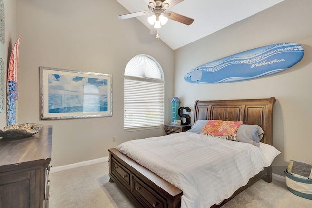 bedroom with light colored carpet, ceiling fan, and lofted ceiling