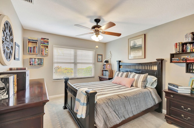 bedroom with ceiling fan and light colored carpet