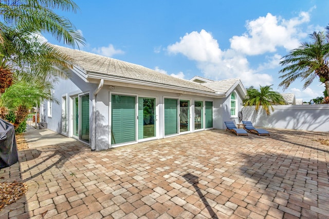 back of house with a patio