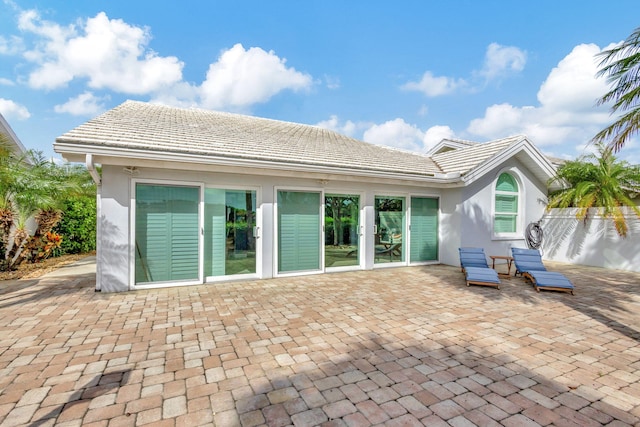 rear view of house with a patio