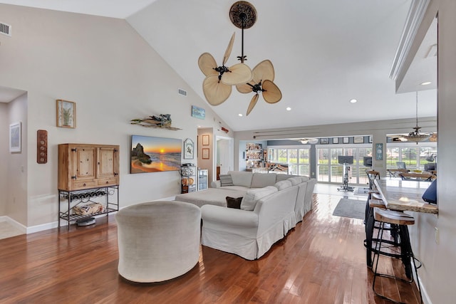 living room with ceiling fan, high vaulted ceiling, and hardwood / wood-style flooring