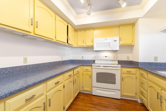 kitchen featuring crown molding, dark hardwood / wood-style flooring, track lighting, and white appliances