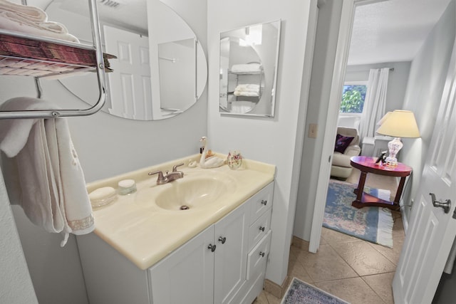 bathroom with vanity and tile patterned floors