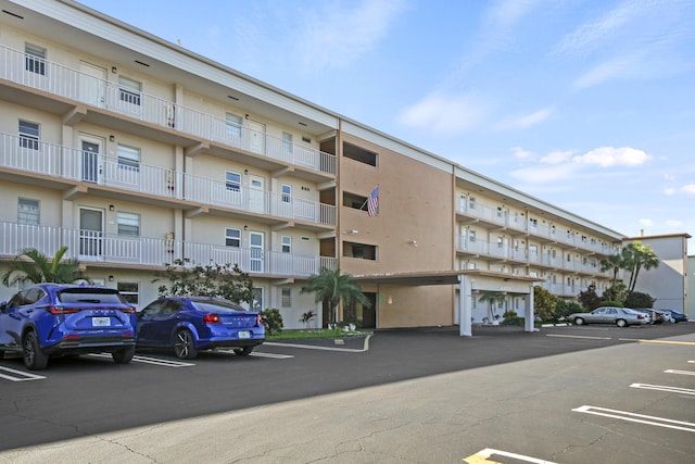 230 NE 26th Ave N Unit 317, Boynton Beach, FL 33435 - view of apartment building / complex featuring uncovered parking
