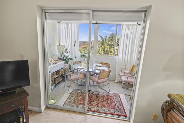 tiled dining area with baseboards