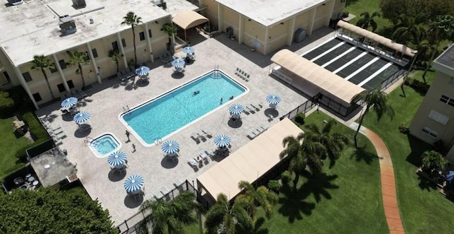 230 NE 26th Ave N Unit 317, Boynton Beach, FL 33435 - aerial view of property and surrounding area featuring a pool area