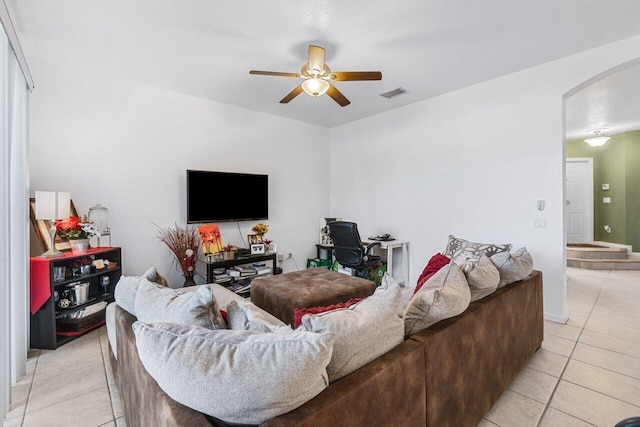 living room with ceiling fan and light tile patterned flooring