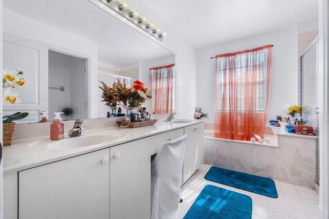 bathroom with tile patterned flooring, vanity, and shower / tub combination