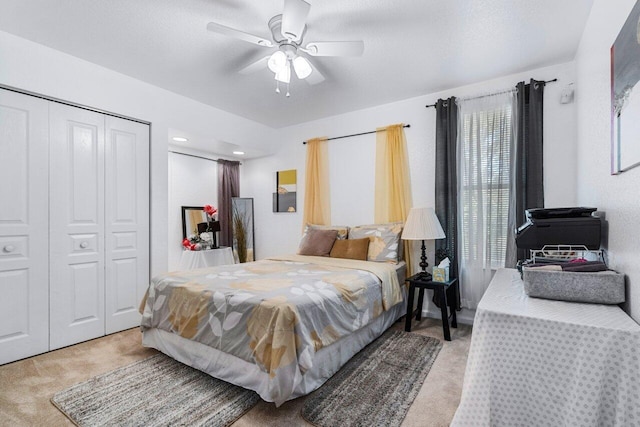 carpeted bedroom with ceiling fan